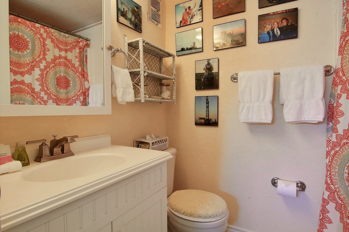 Your charming bathroom features fresh white linens and personal touches that make you feel right at home.