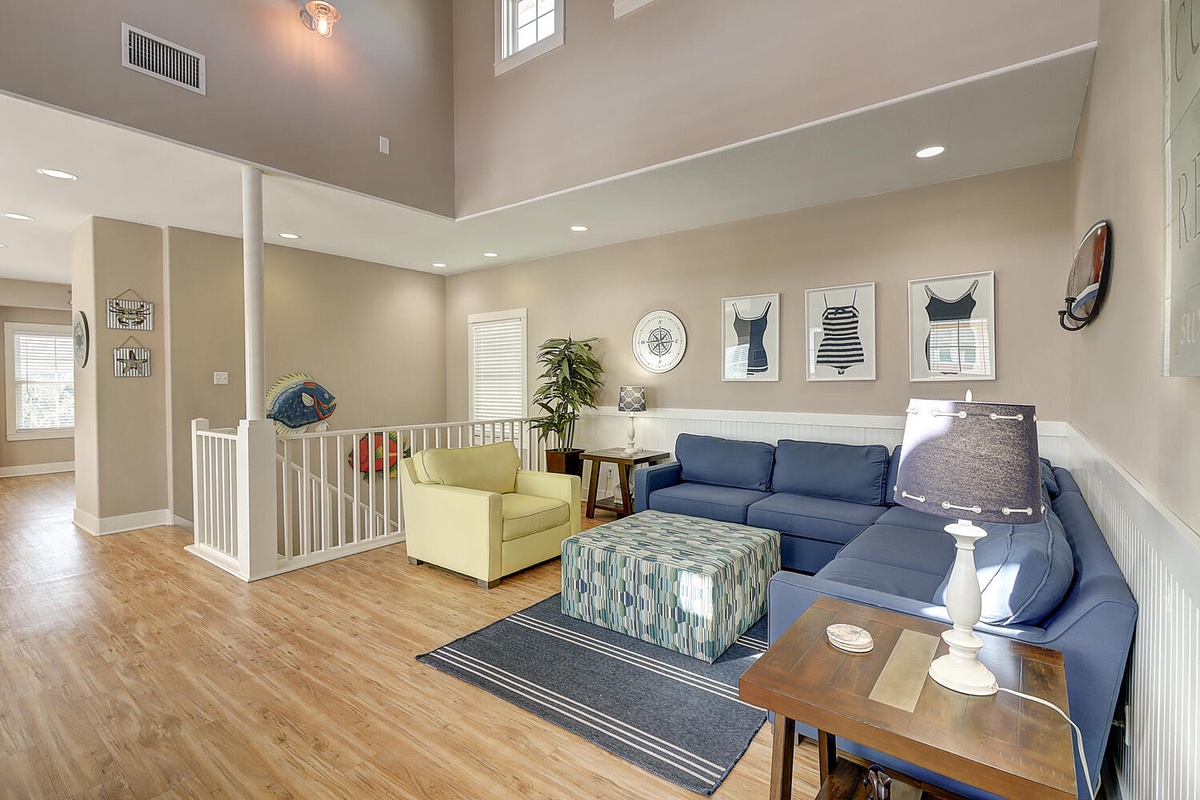 Relax in your bright, airy living space with vaulted ceilings, coastal decor, and comfortable seating perfect for unwinding after adventures.