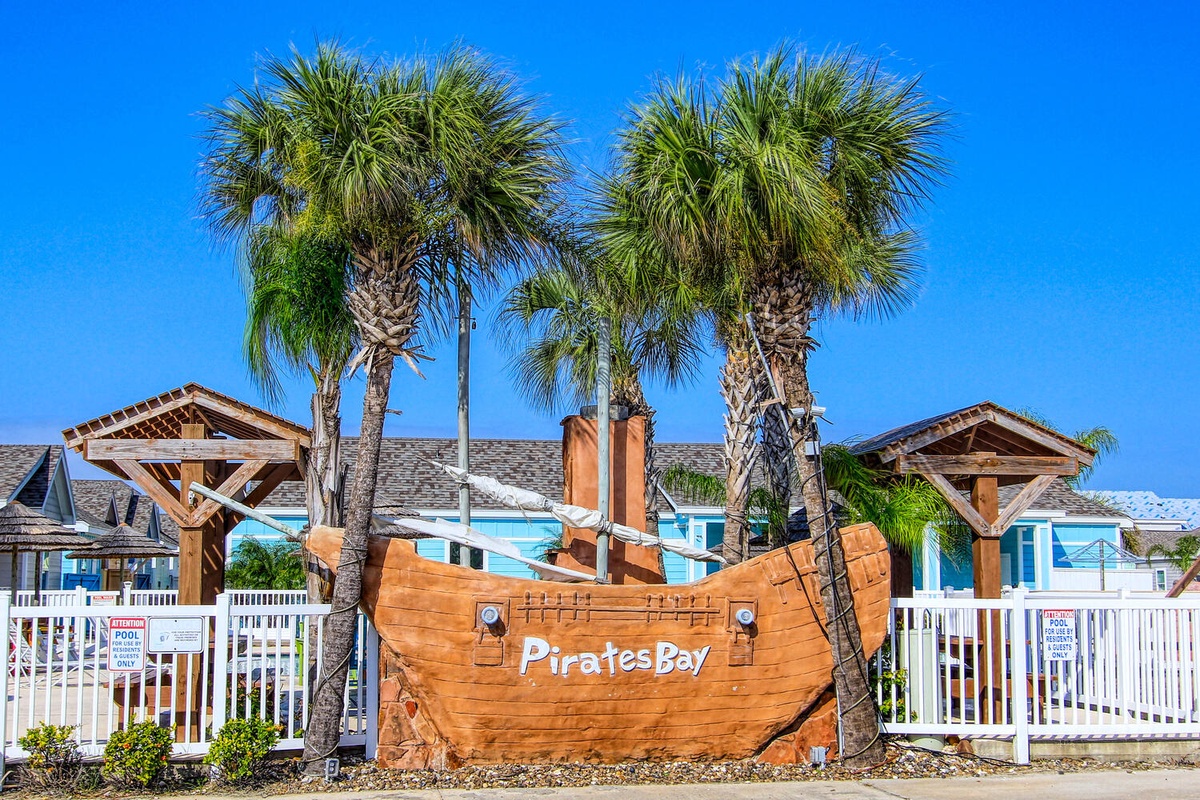 Welcome to Pirates Bay, where adventure awaits beneath swaying palm trees and clear blue skies.