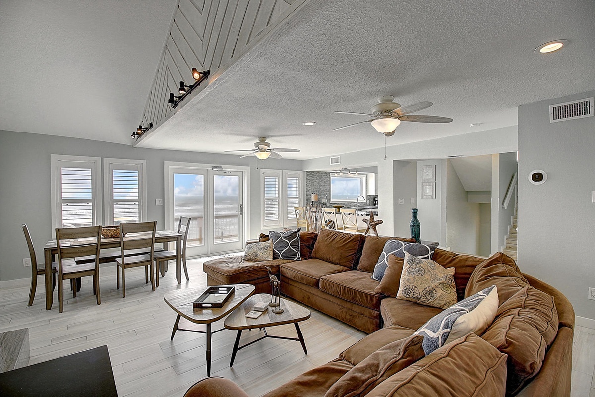Sink into plush leather seating while ocean breezes flow through your bright, airy retreat with stunning beach views.