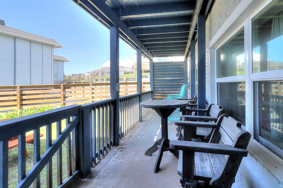 Relax on your covered balcony with outdoor dining space, enjoying peaceful views of the surrounding neighborhood.