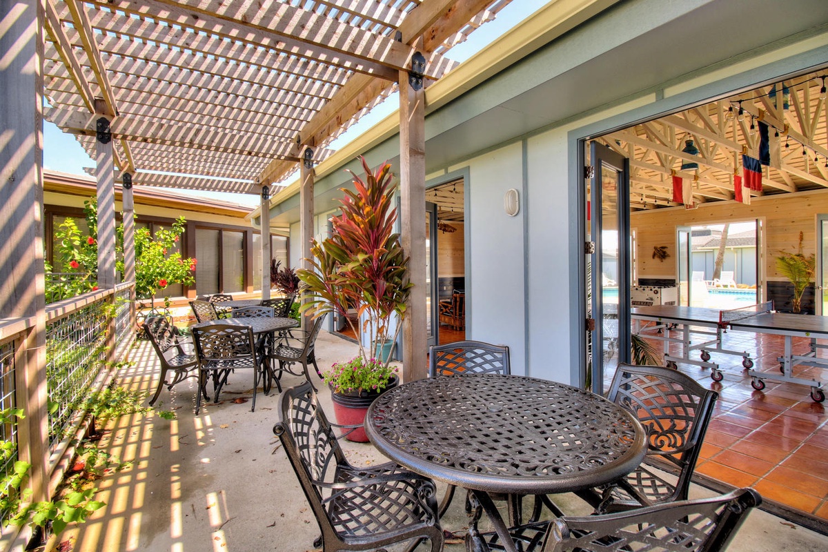 Your private terrace offers dappled sunlight through elegant pergolas, where tropical plants frame intimate dining spaces perfect for morning coffee or evening meals.
