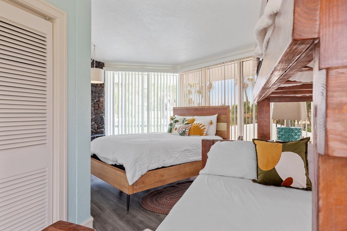 Drift off in your cozy retreat with warm wood accents, soft linens, and natural light streaming through blinds.
