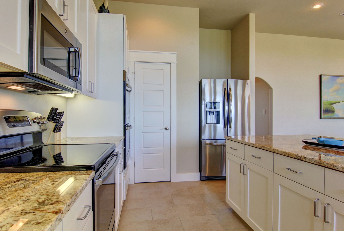 Your fully equipped kitchen features granite countertops, stainless steel appliances, and everything you need to prepare delicious meals during your stay.