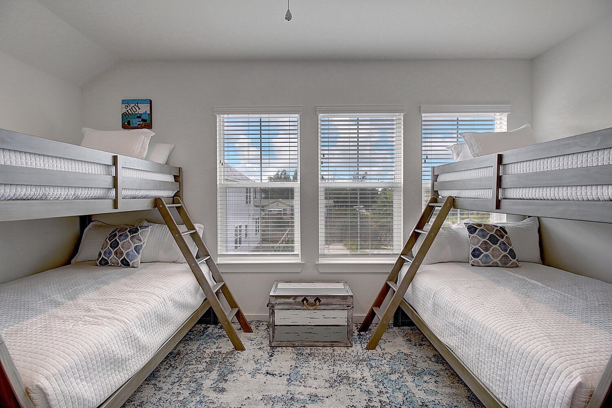 Your kids will love this cozy bunk room with two full-size beds, perfect for family adventures and bedtime stories.