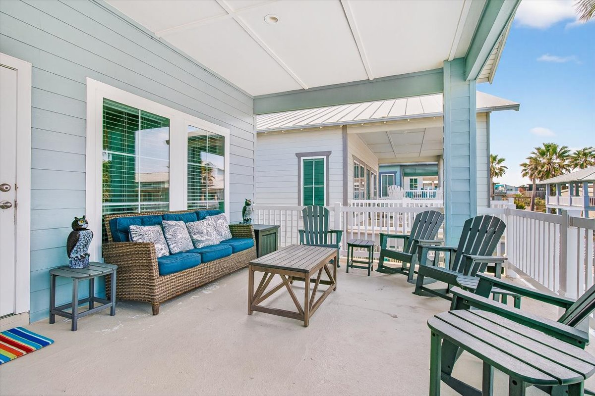 Relax on your private covered porch with comfortable seating and tropical breezes. The perfect spot to unwind with morning coffee or evening cocktails.