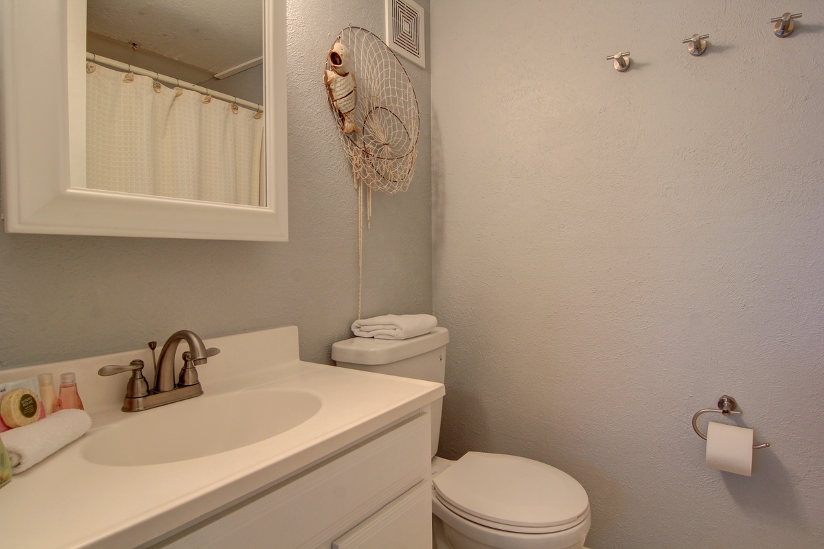 Your private bathroom features a spacious vanity and thoughtful touches, creating a comfortable retreat for your stay.
