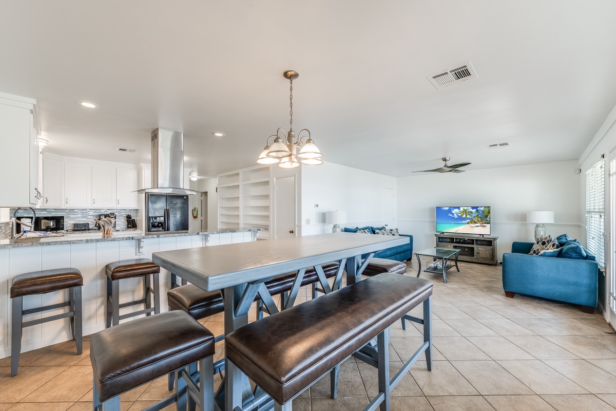 Your open-concept space flows from gourmet kitchen to cozy living room, perfect for gathering with loved ones over home-cooked meals.