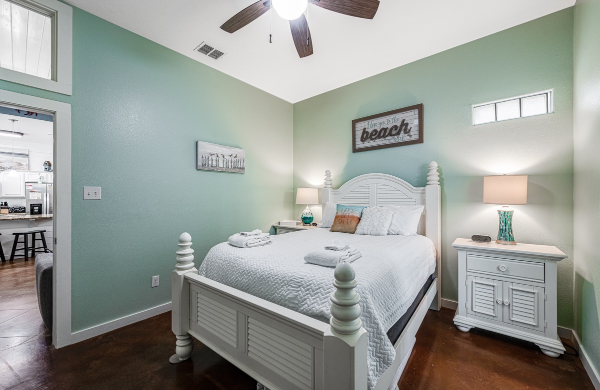 Rest peacefully in your coastal-themed bedroom with crisp linens, soothing sea-green walls, and charming beach decor creating the perfect seaside retreat.
