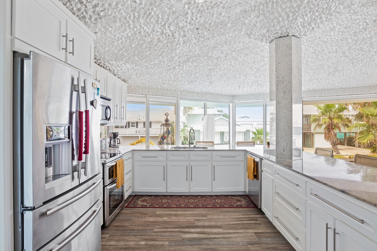 Your fully equipped kitchen features modern appliances and opens to stunning views, creating the perfect space for cooking memorable meals.