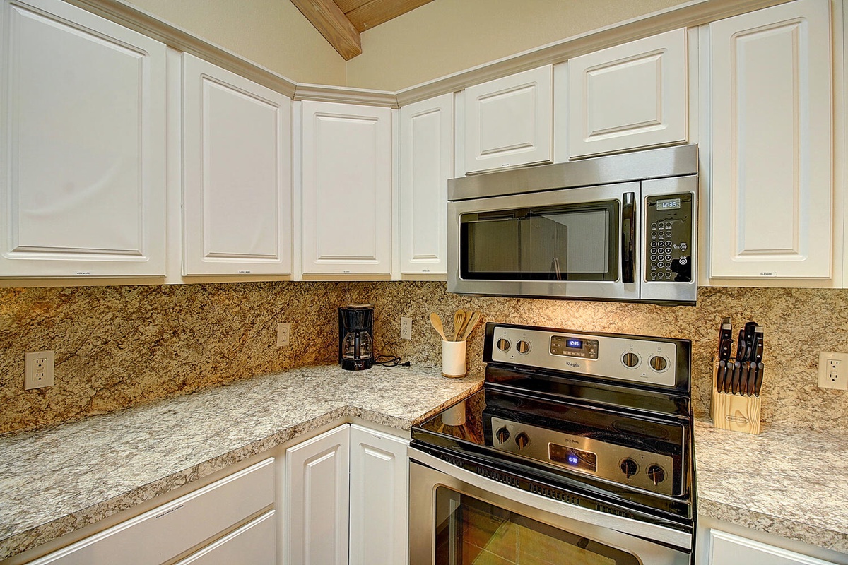 Your fully-equipped kitchen awaits with granite countertops, stainless appliances, and everything you need for home-cooked meals during your stay.