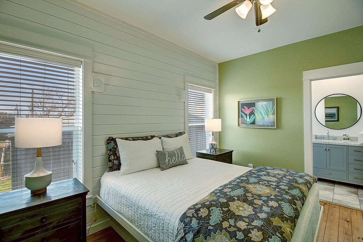 Drift into restful sleep in this charming bedroom with fresh coastal colors, crisp linens, and your own private bathroom.