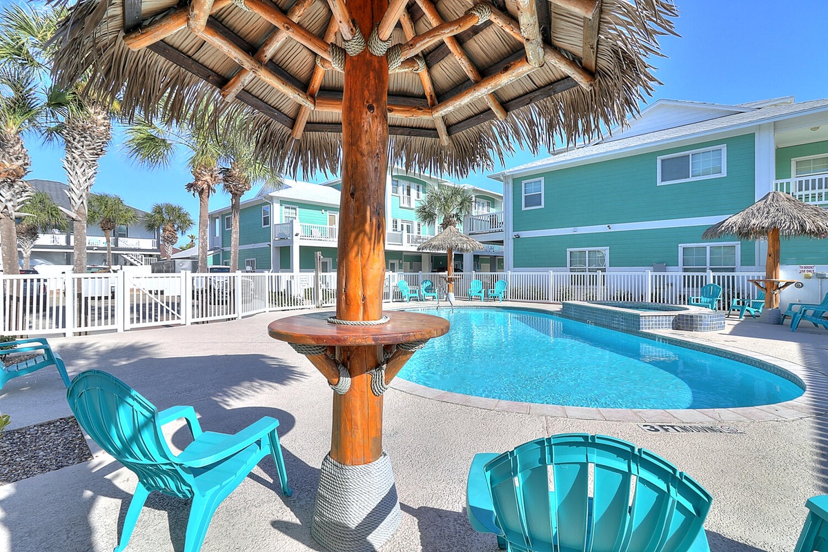 Dive into tropical paradise at your private pool oasis, where tiki-style shade and turquoise waters create the perfect beach getaway.