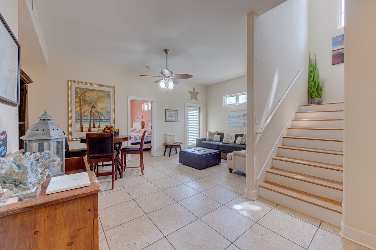 Relax in your bright, coastal-themed living space with comfortable seating and thoughtful touches throughout.