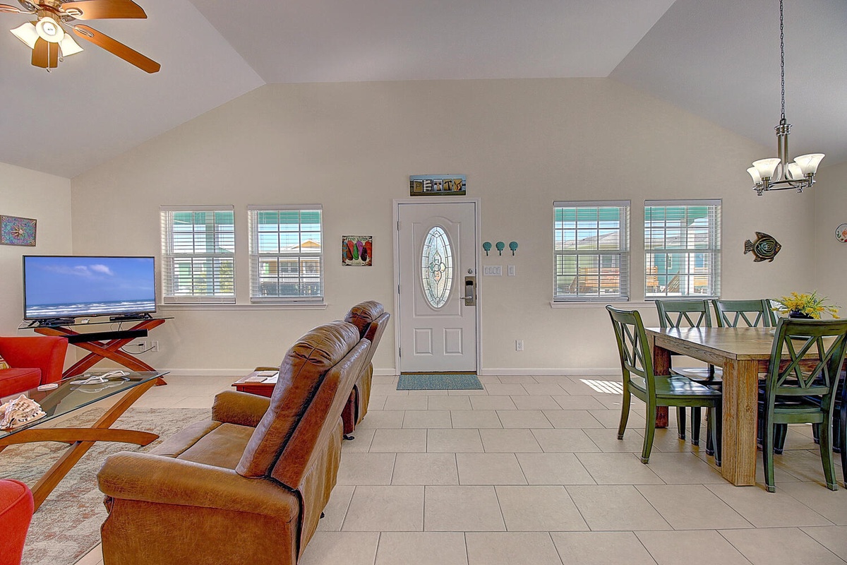 Relax in your spacious open-plan living space with comfortable seating, dining for six, and modern amenities.
