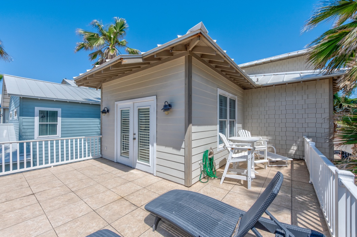 Soak up Florida sunshine on your private terrace with comfortable seating and tropical palm trees swaying overhead.