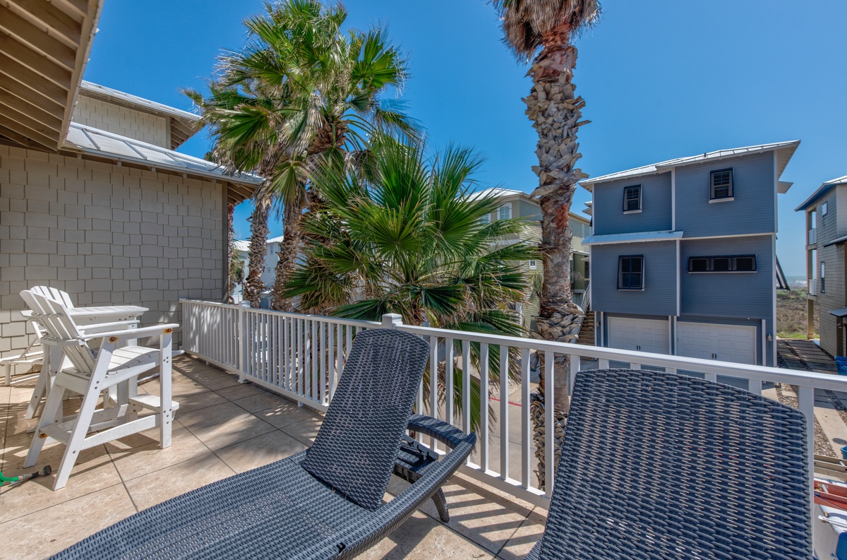 Step onto your private balcony and soak up tropical vibes with palm trees swaying in the coastal breeze.