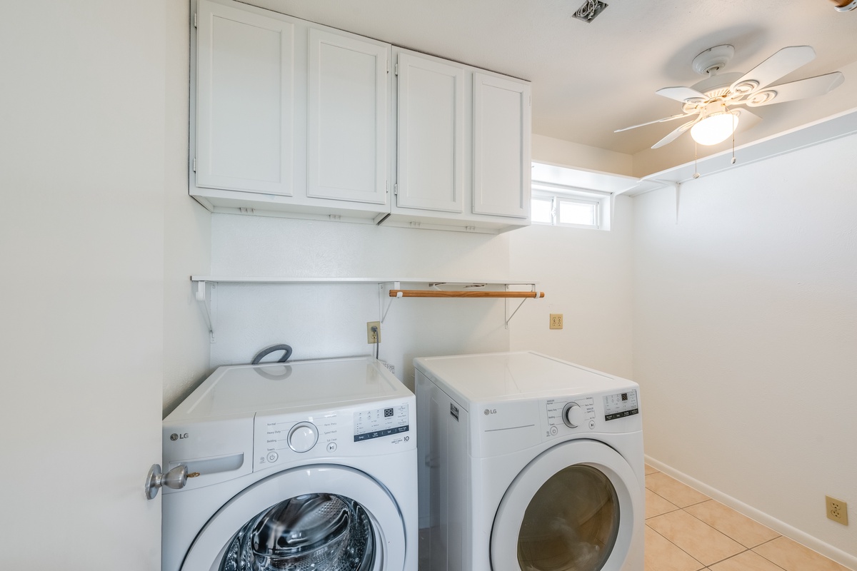 Your dedicated laundry room keeps travel light with modern washer and dryer, plus ample cabinet storage for all your essentials.