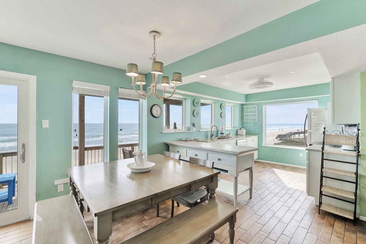 Soak in breathtaking ocean views from your bright, coastal-inspired kitchen and dining space with panoramic windows framing the endless sea.