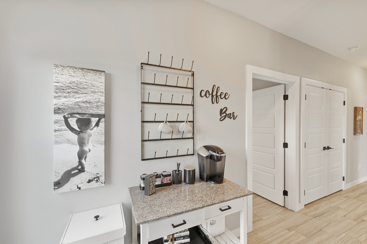 Your morning ritual awaits at your private coffee bar, complete with premium brewing equipment and stylish mug display for that perfect cup.
