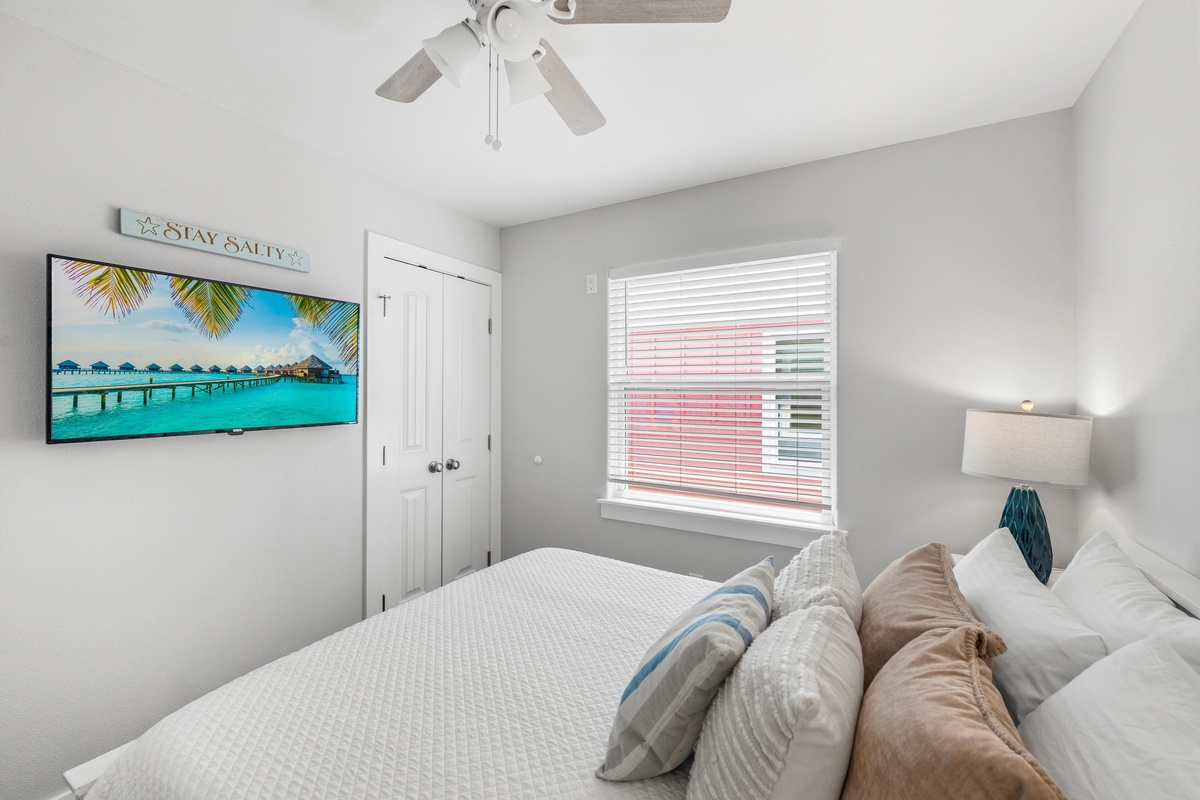 Drift off in this serene bedroom where coastal charm meets comfort. Plush bedding, soft natural light, and beachy touches create your perfect retreat after a day of exploring.