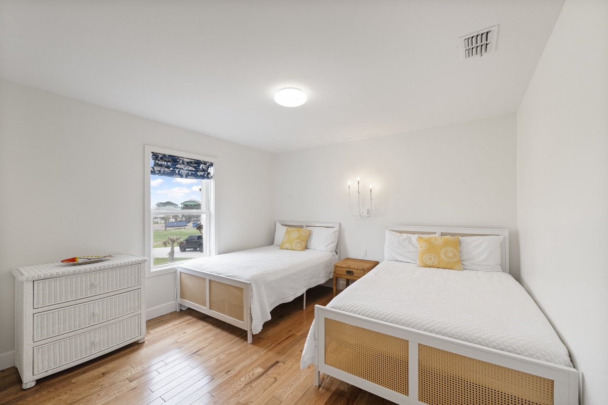 Drift off peacefully in your twin bedroom where coastal charm meets comfort with crisp linens and warm hardwood floors.