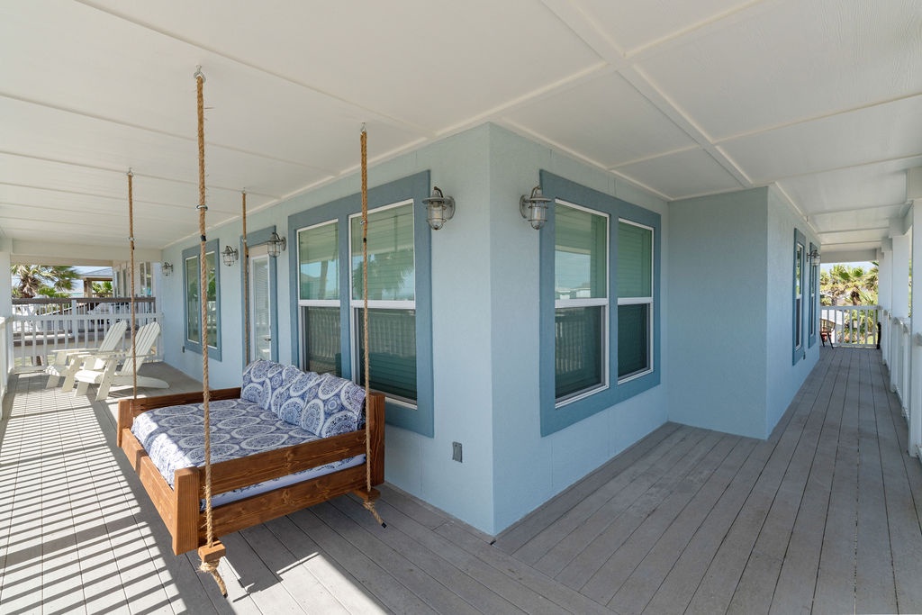 Sway gently on your private porch swing while coastal breezes drift through, creating your perfect spot for morning coffee or sunset relaxation.