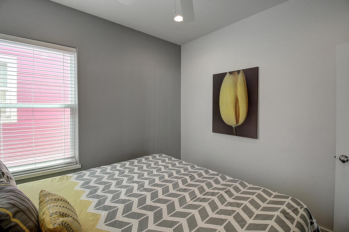 Drift into peaceful sleep in your stylish bedroom featuring modern artwork and a geometric duvet.