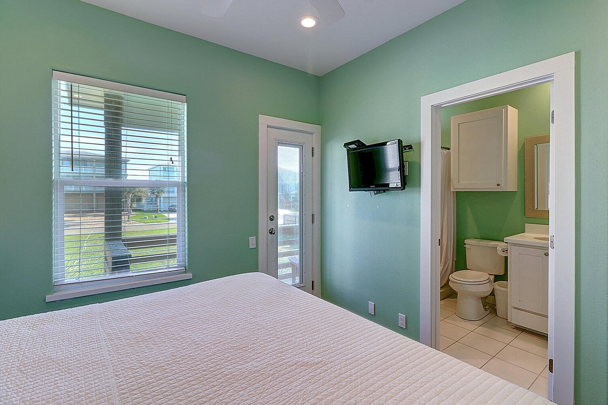Drift off in your peaceful bedroom featuring soothing mint walls, natural light, and your own private ensuite bathroom for ultimate convenience.