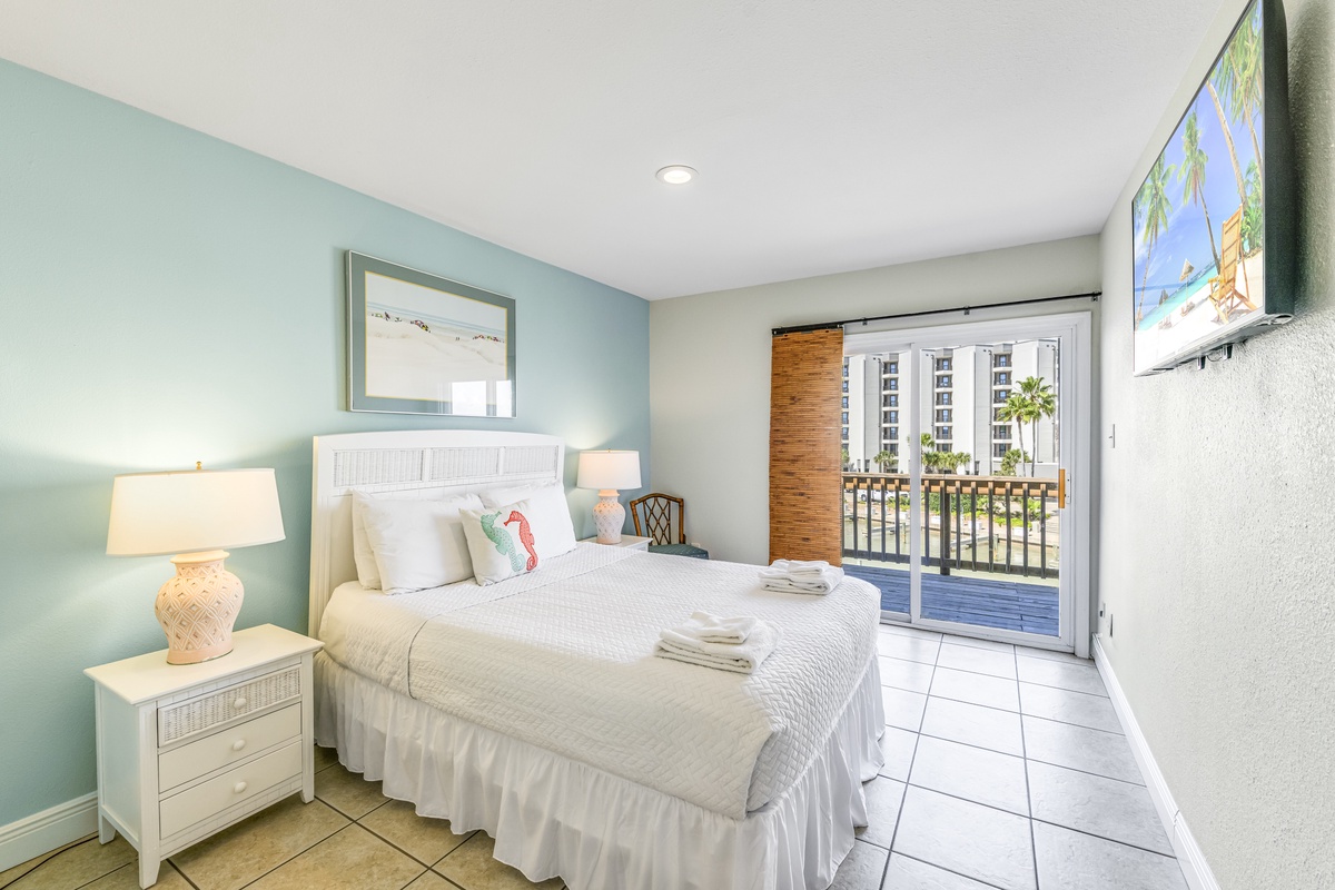 Wake up refreshed in your coastal-themed bedroom with soft linens and private balcony access to start each morning perfectly.