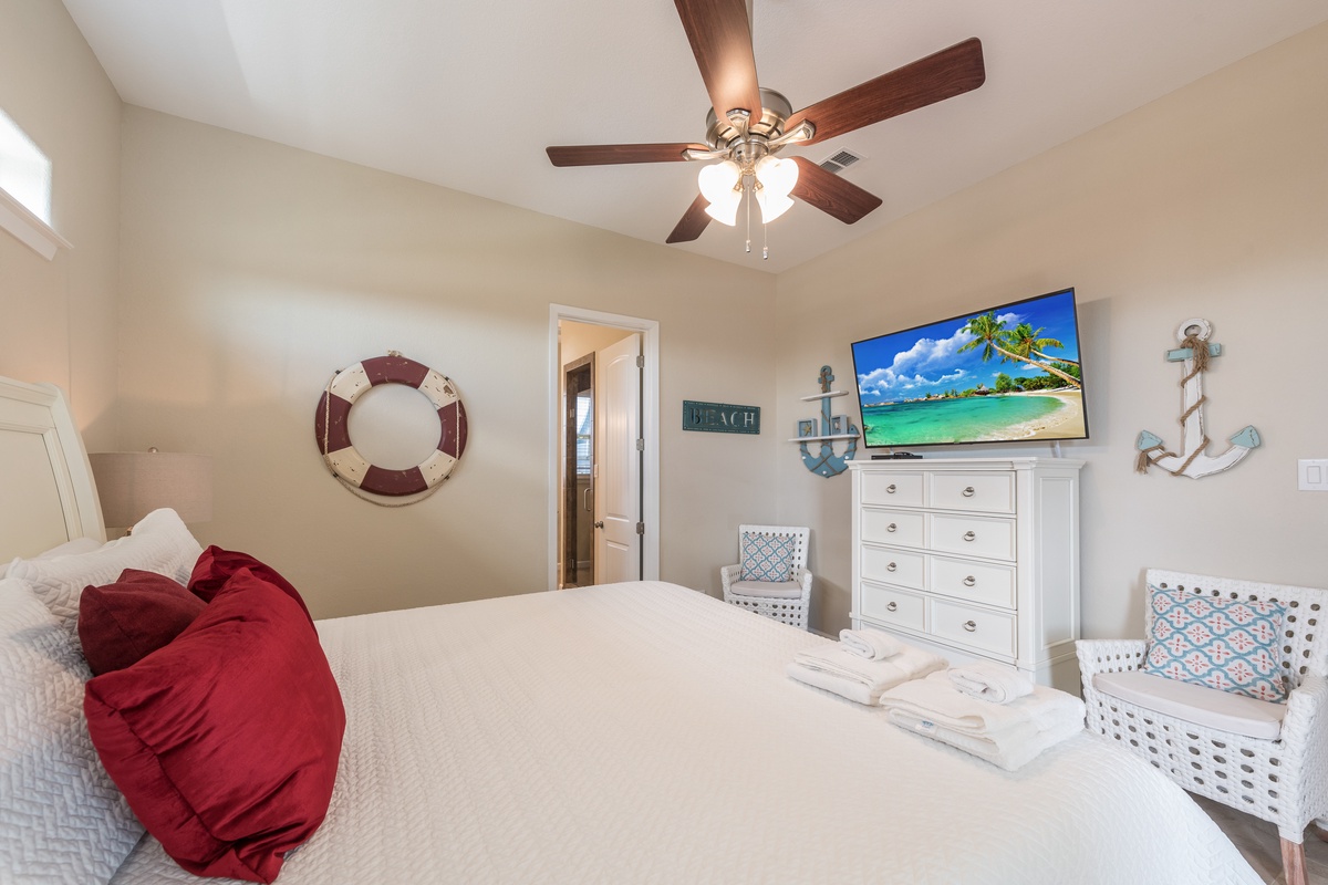 Your nautical-themed bedroom awaits with tropical dreams on the wall-mounted TV and cozy coastal charm throughout.