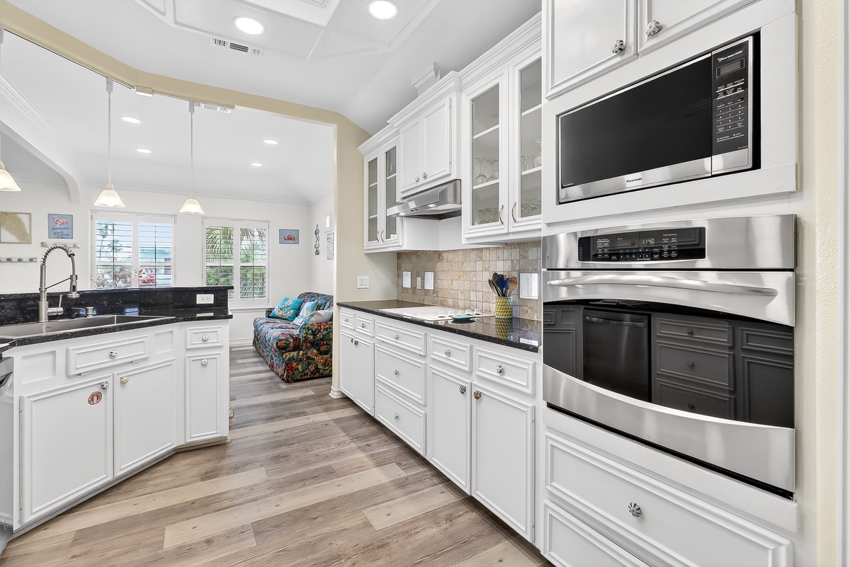Your spacious kitchen features gleaming appliances, ample counter space, and bright natural light flowing through large windows.