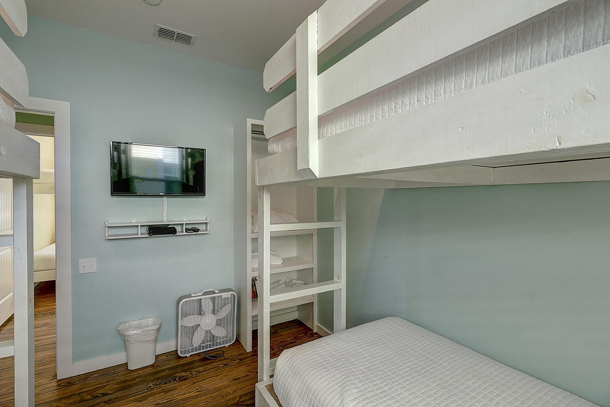 Your cozy bunk room features built-in storage, private TV, and thoughtful details for a comfortable stay.