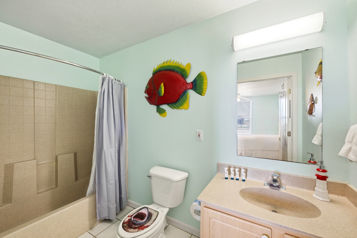 Step into your bright coastal bathroom, complete with cheerful sea-themed touches and everything you need to refresh after a day of fun.