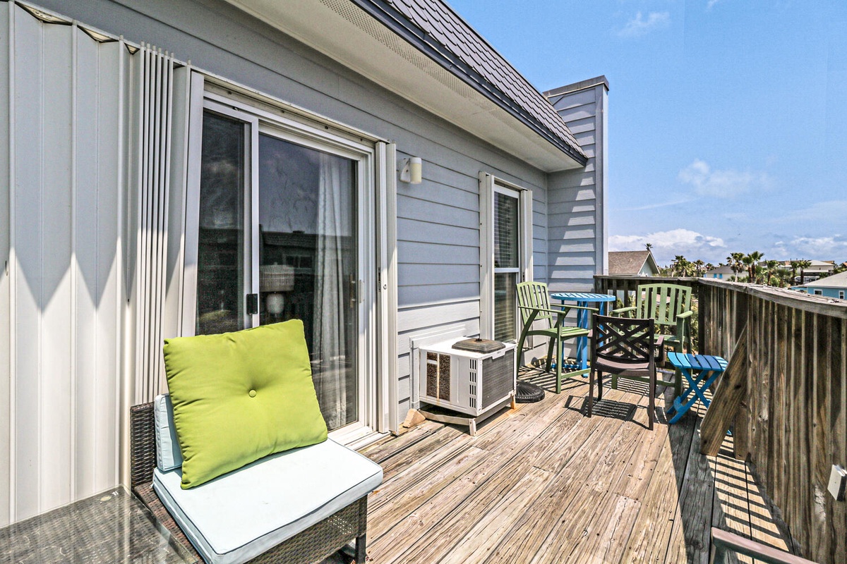Step onto your private deck where coastal breezes and comfortable seating create the perfect spot for morning coffee or evening relaxation.