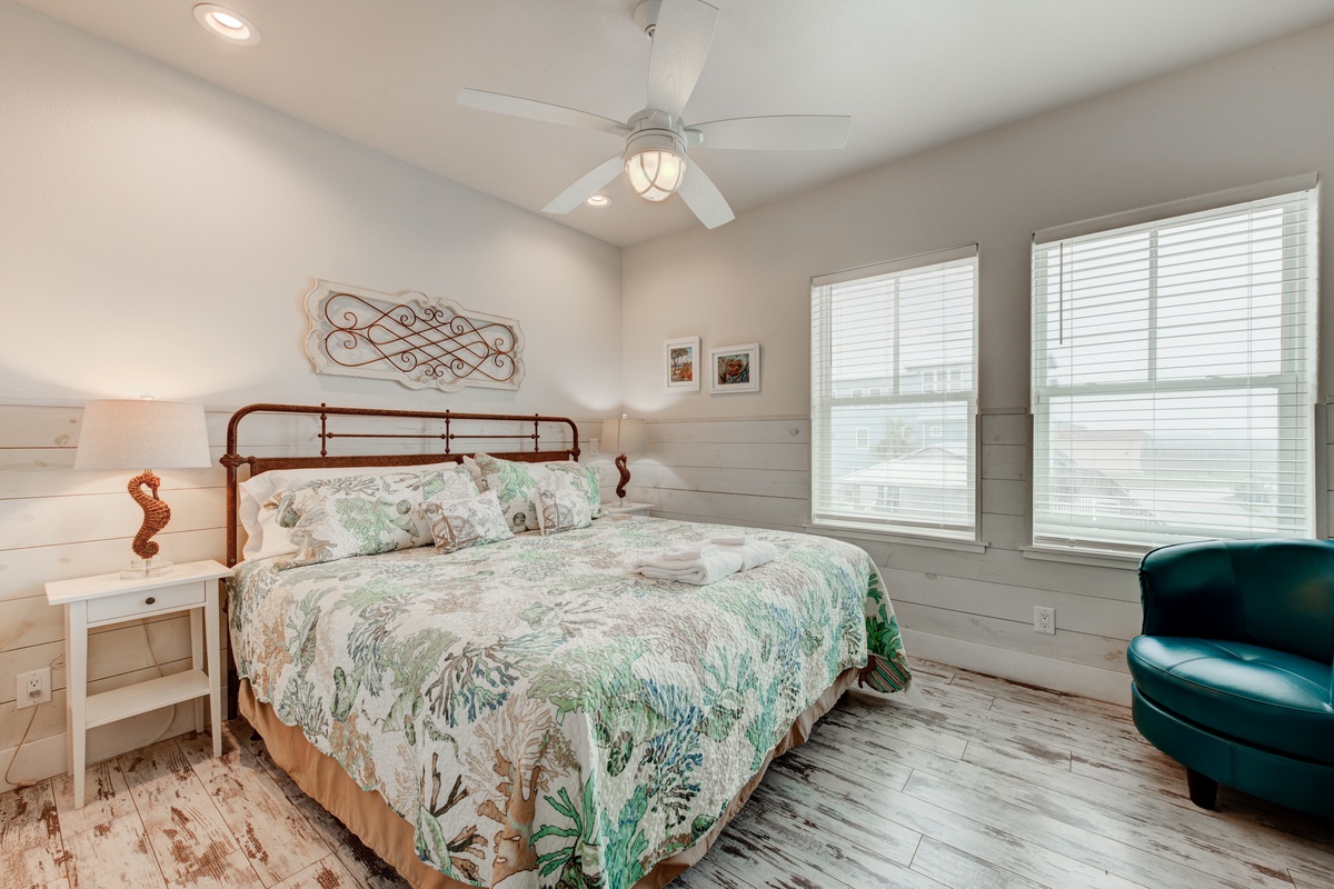 Drift off peacefully in your bright, coastal bedroom with botanical bedding and charming nautical touches throughout.