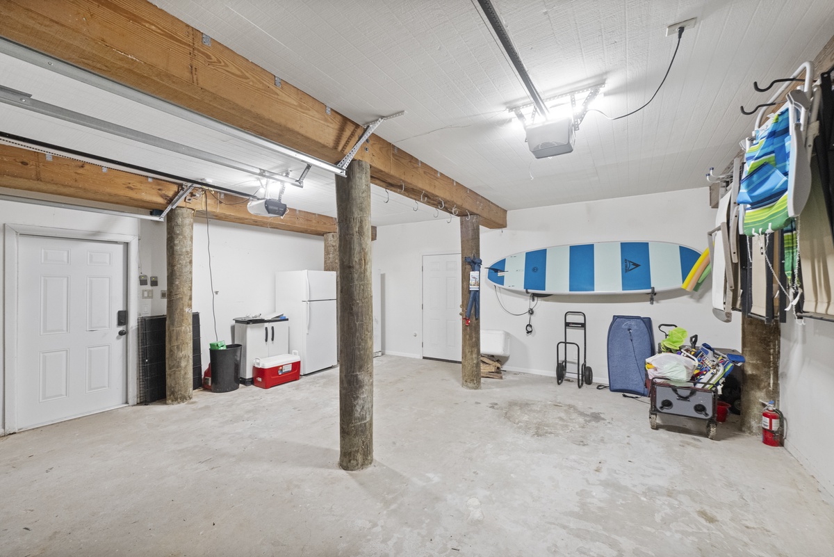 Store your gear and beach equipment in this spacious garage with kayak storage—perfect for organizing your water adventures.