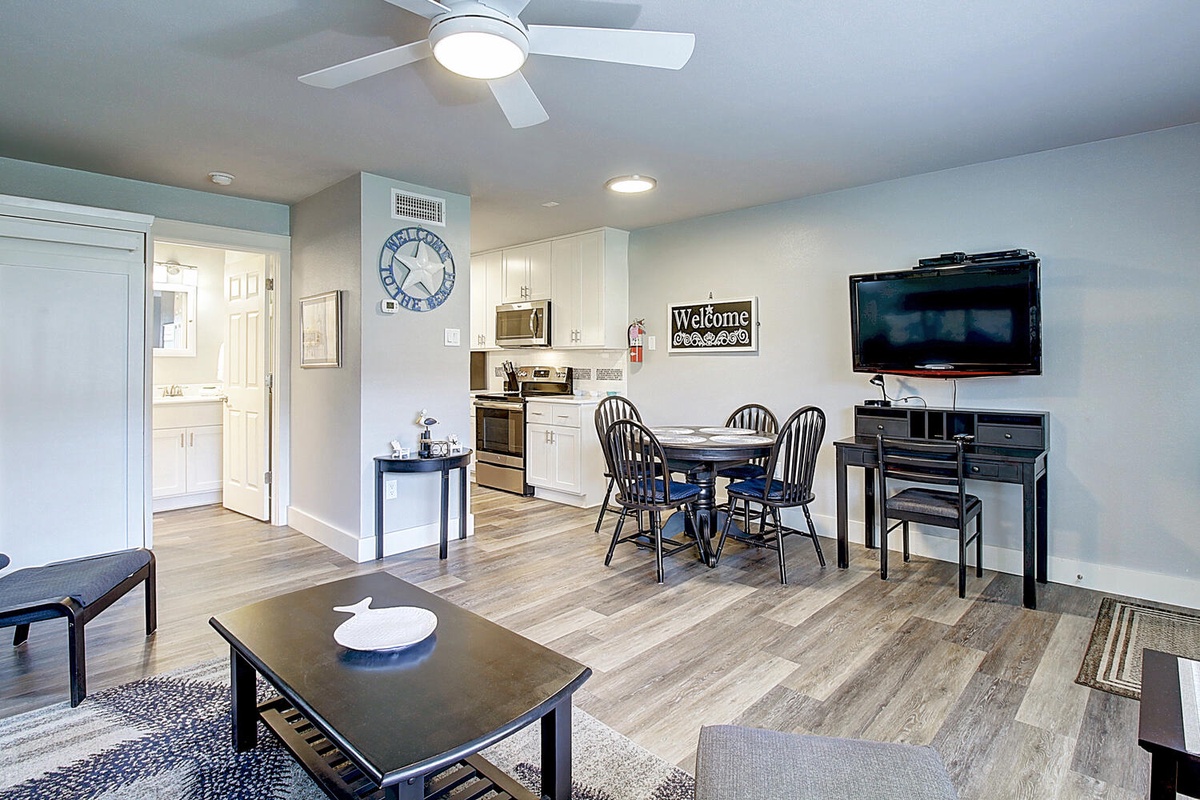 Your bright, open living space blends comfort with convenience—cook in your full kitchen, dine together, then unwind watching TV.