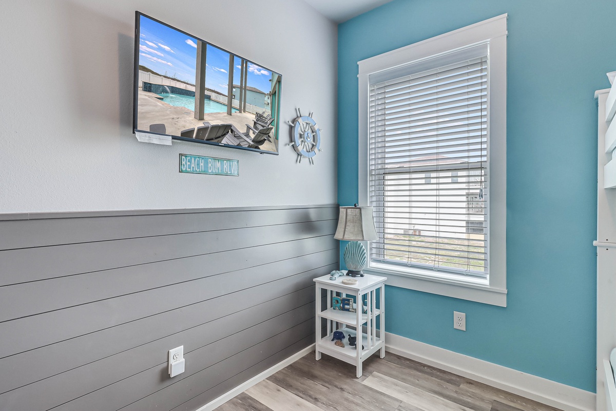 Unwind in your coastal-themed bedroom where ocean blues and beach vibes create the perfect retreat for your seaside getaway.