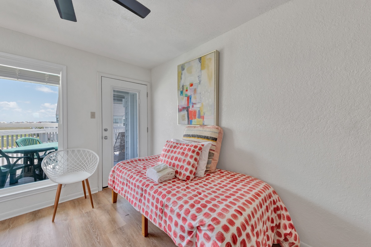 Relax in your bright reading nook with modern art and balcony access, perfect for afternoon moments with coffee and a good book.