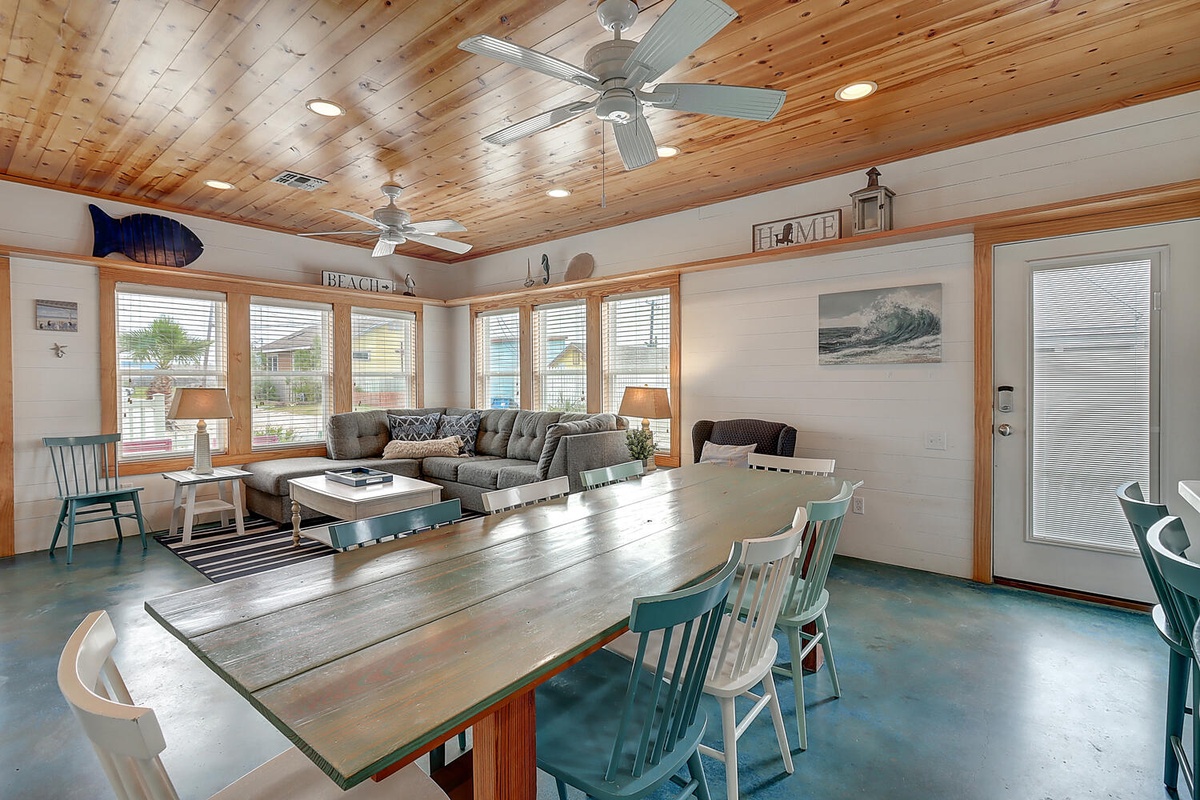 Relax in your bright, beach-themed living space with comfortable sectional seating and ocean-inspired décor.
