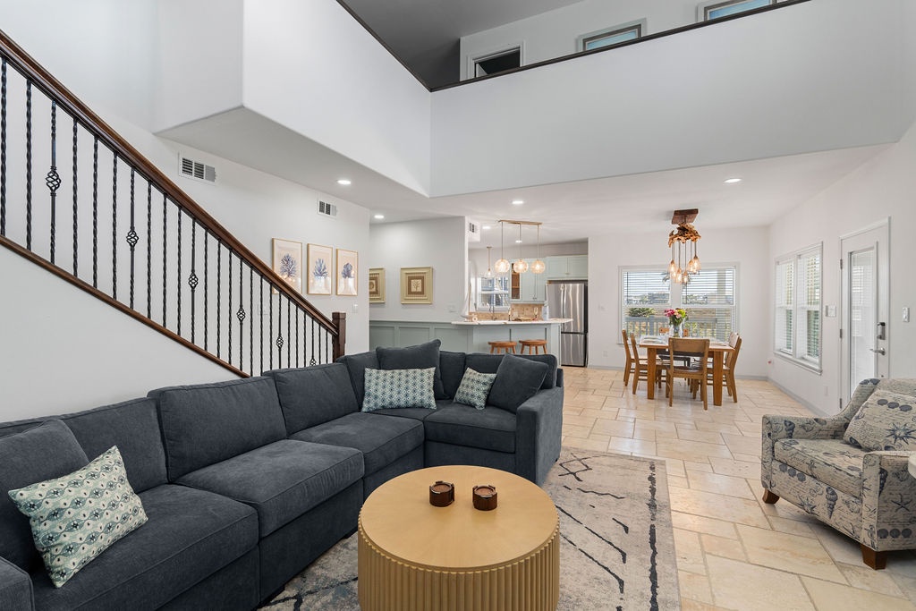 Sink into your spacious sectional sofa where open-concept living flows seamlessly from lounge to kitchen to dining - perfect for gatherings.