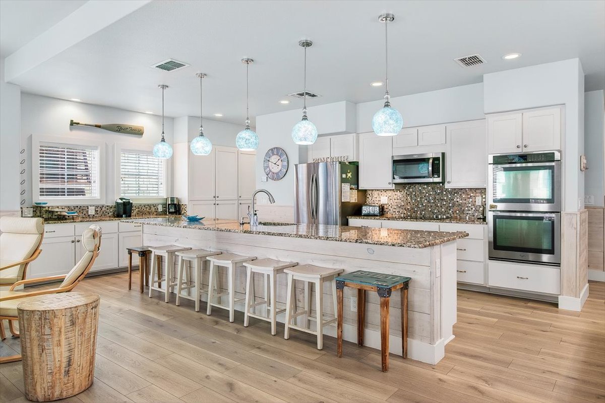 Your spacious gourmet kitchen awaits with granite counters, stainless appliances, and a perfect island for gathering with family and friends.
