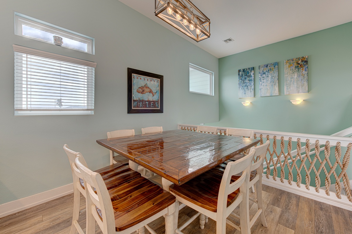Gather around your spacious dining table where natural light flows through plantation shutters, creating the perfect setting for memorable meals together.