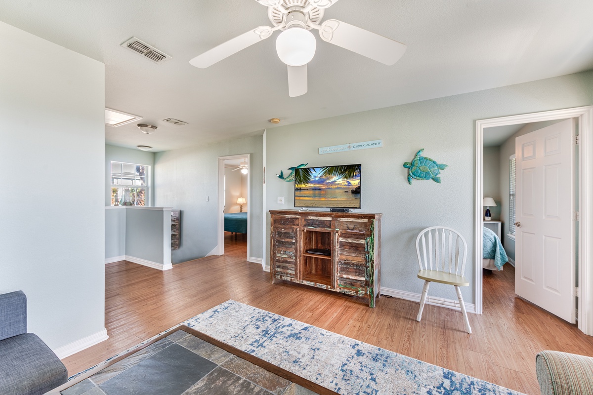 Relax in your coastal-themed living space with beautiful hardwood floors, charming rustic decor, and nautical touches that make you feel right at home.