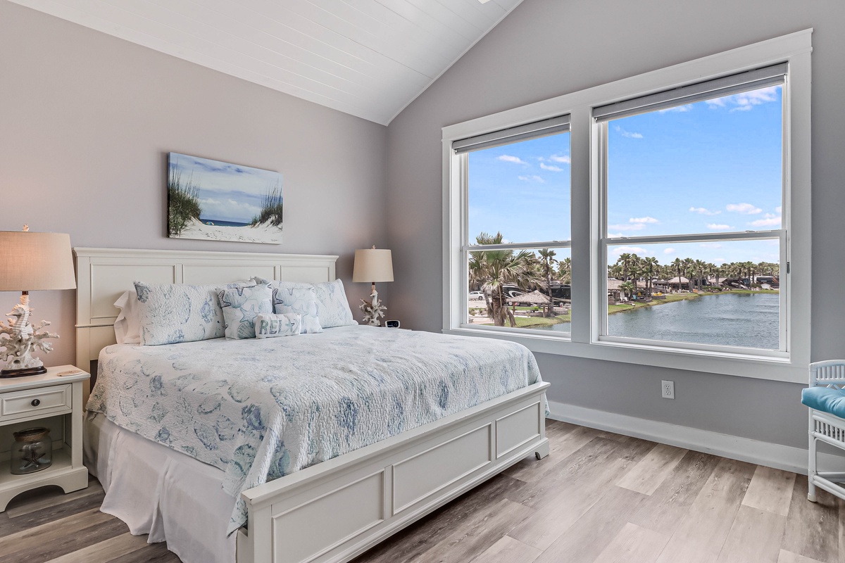 Wake up to stunning waterfront views from your comfortable bed, where coastal-themed décor creates a serene retreat.
