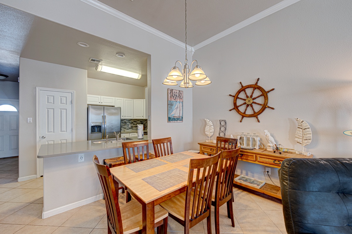 Gather around your beautiful dining table with nautical charm, where warm wood tones and maritime décor create the perfect setting for memorable meals together.