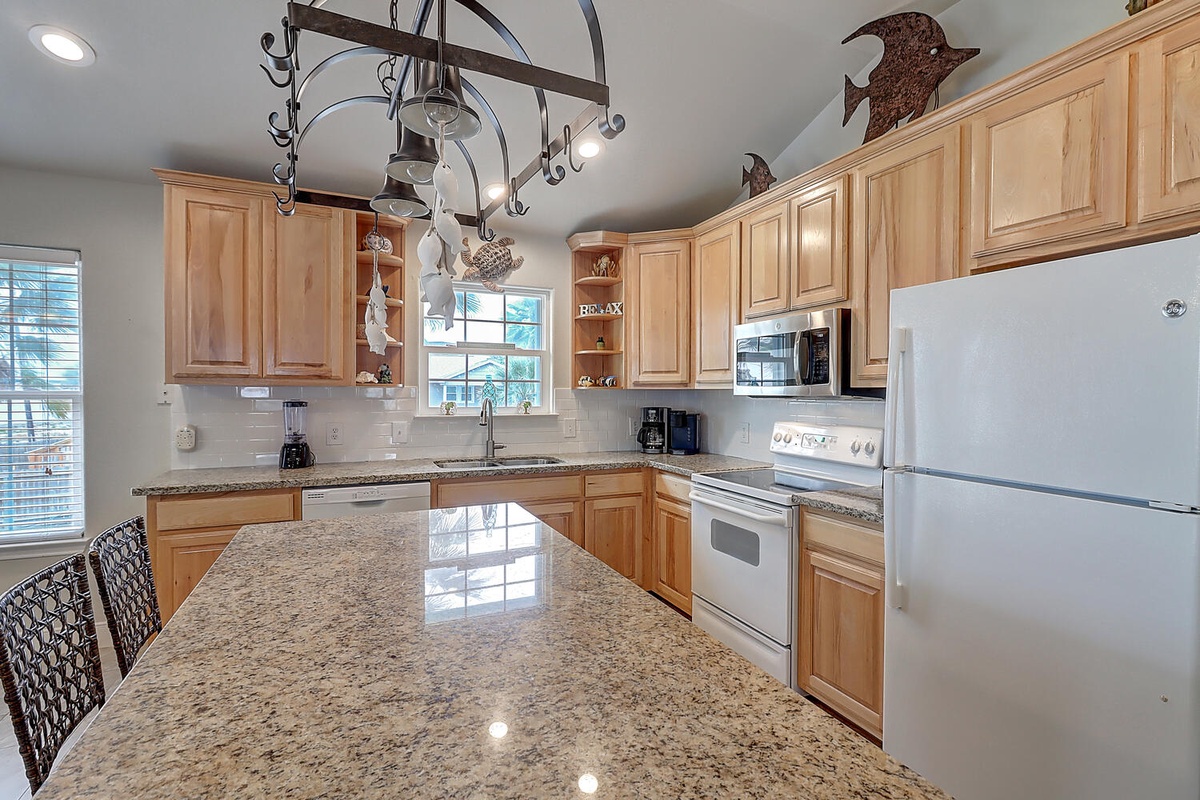 Your fully equipped kitchen awaits with granite counters, modern appliances, and charming rustic touches for memorable meal preparation.
