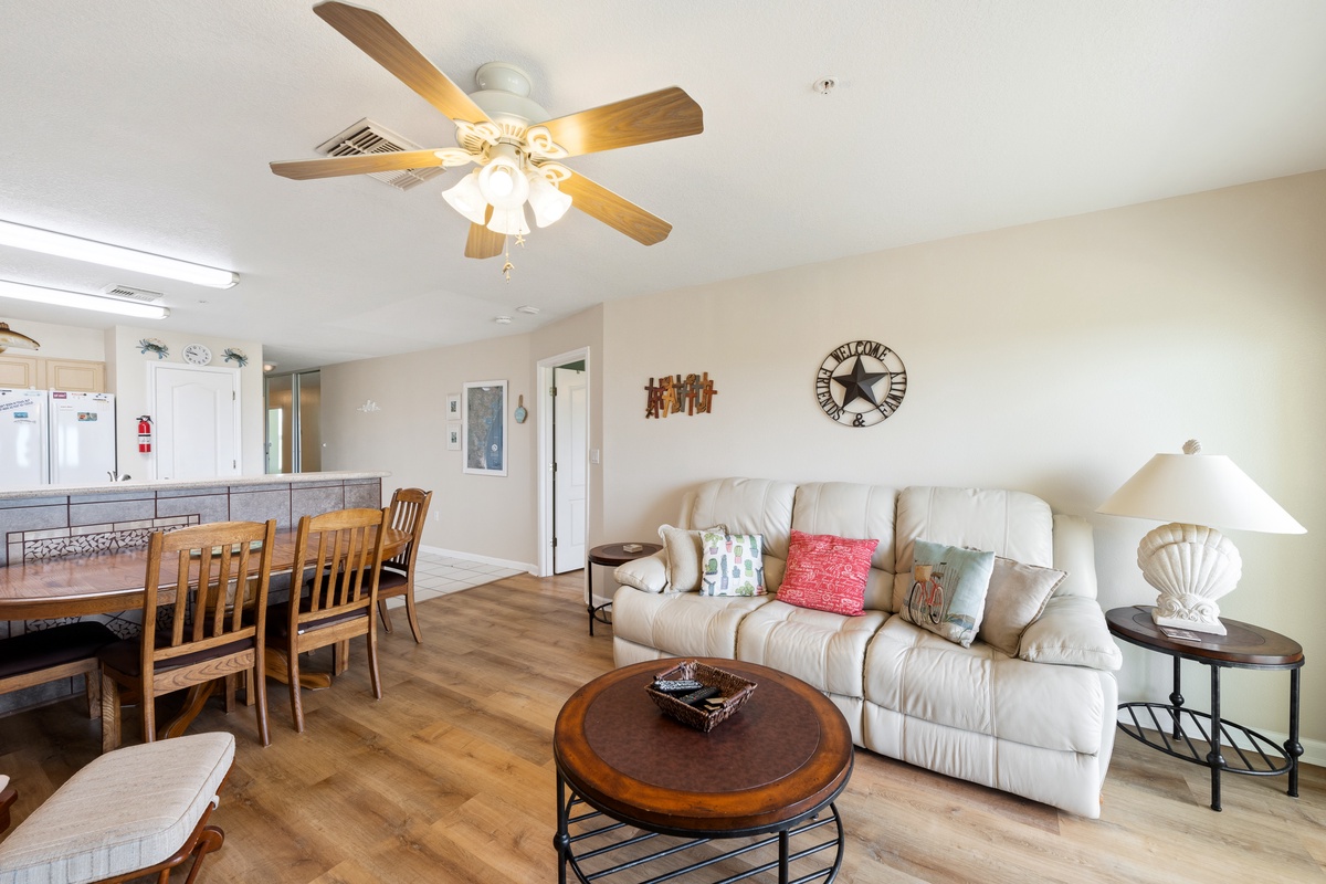 Step into your bright, welcoming living space where comfort meets Texas charm. Relax on the plush sofa, gather around the dining table, and enjoy the warm wood tones throughout.