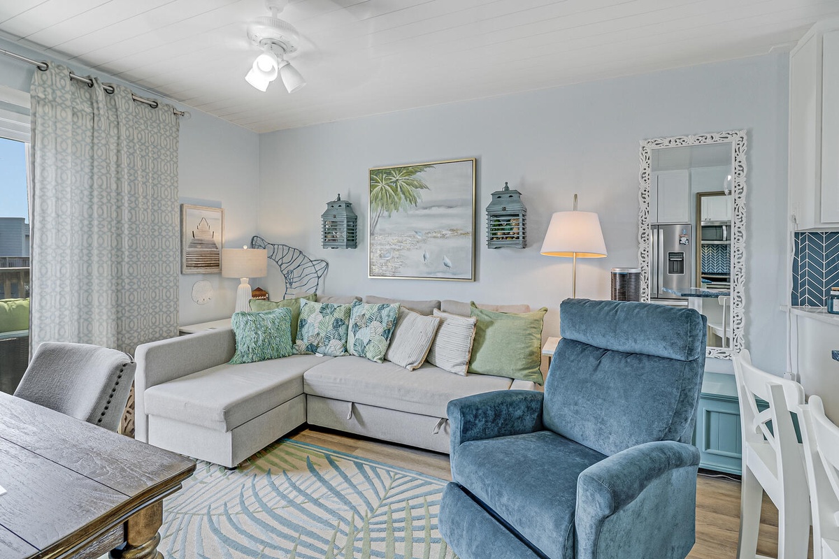 Sink into plush coastal comfort where soft blues meet sea-inspired decor, creating your perfect retreat.